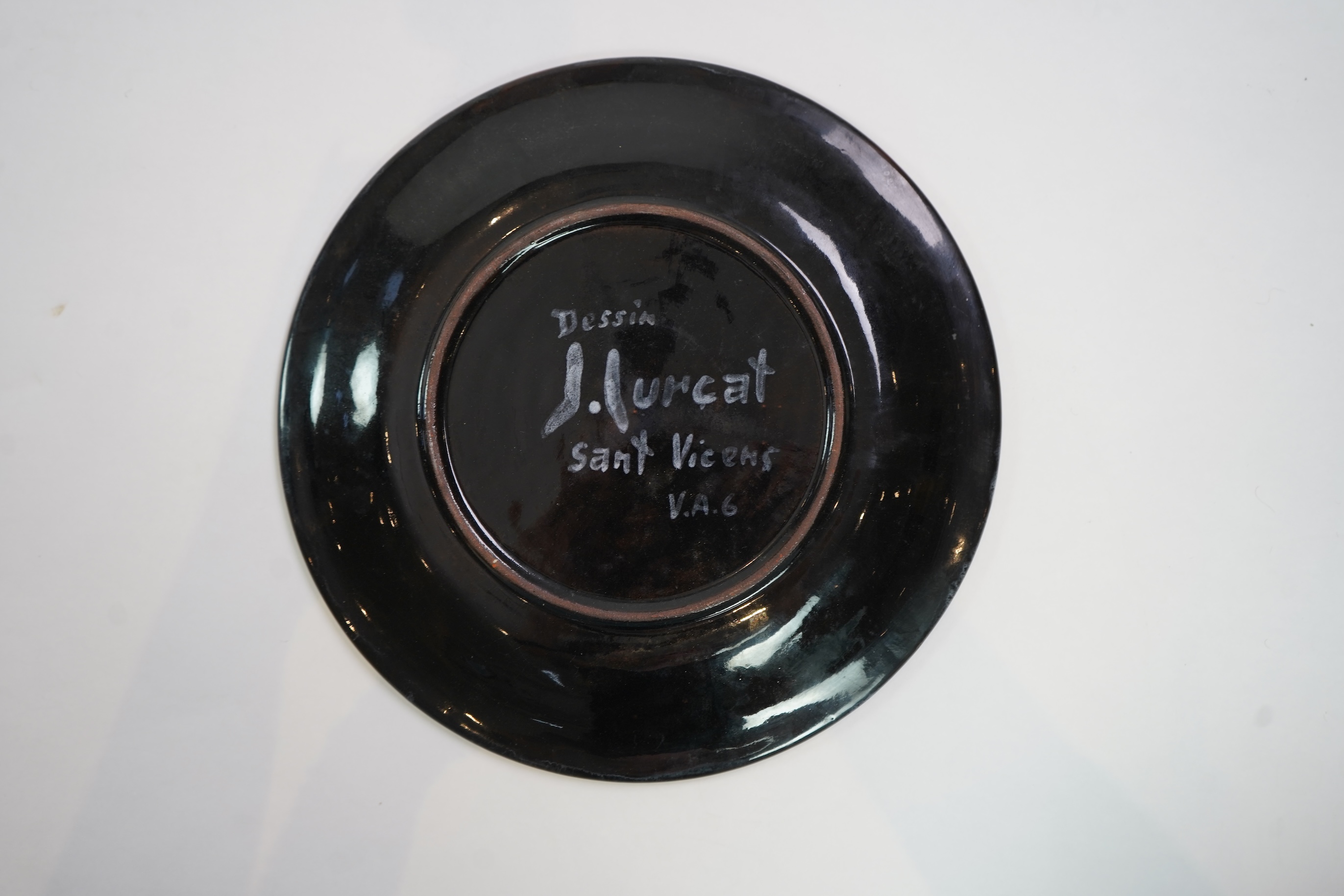 Jean Lurçat (1892-1966): A green glazed earthenware plate, decorated with a stylised central figure